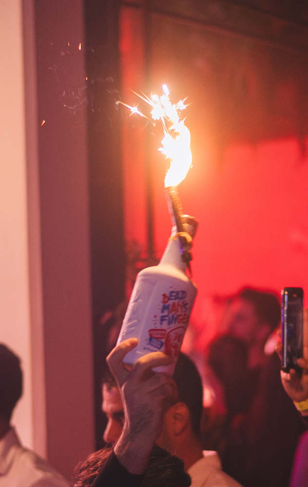 Botella de reservado con bengala en Alboroto Las Palmas